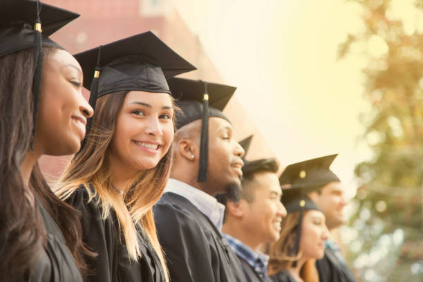 Diverse graduating students in caps and gowns