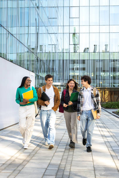 Group of students walking on campus together